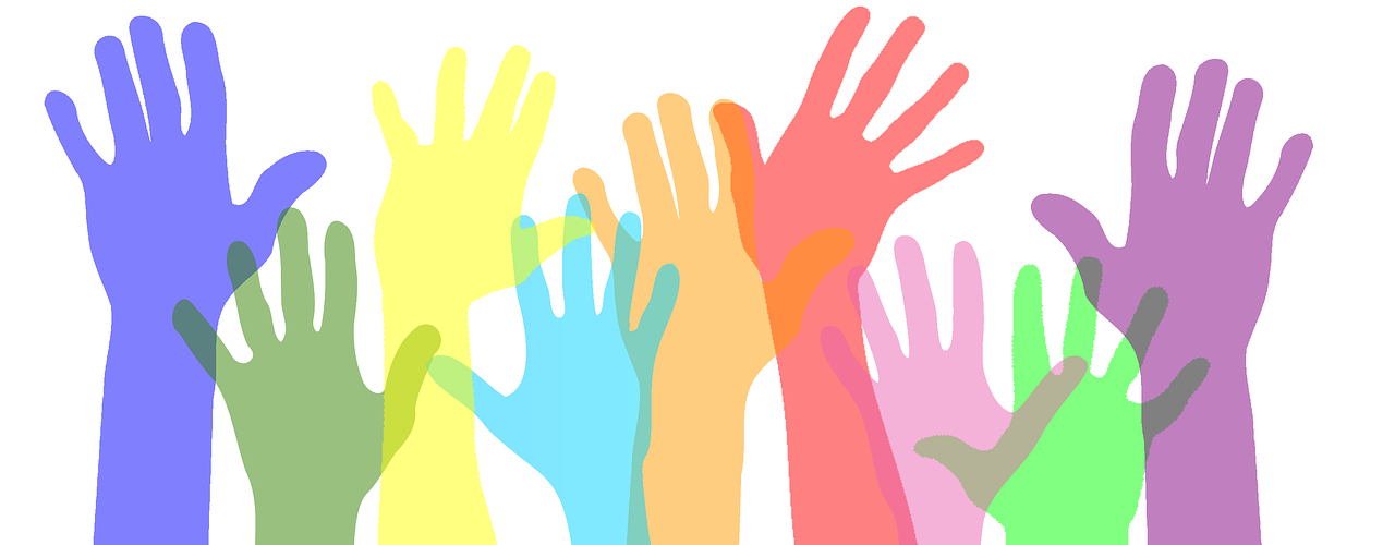 The picture shows a blue, a green, a yellow, a light blue, an orange, a red, a pink, a green and a purple hand reaching up.