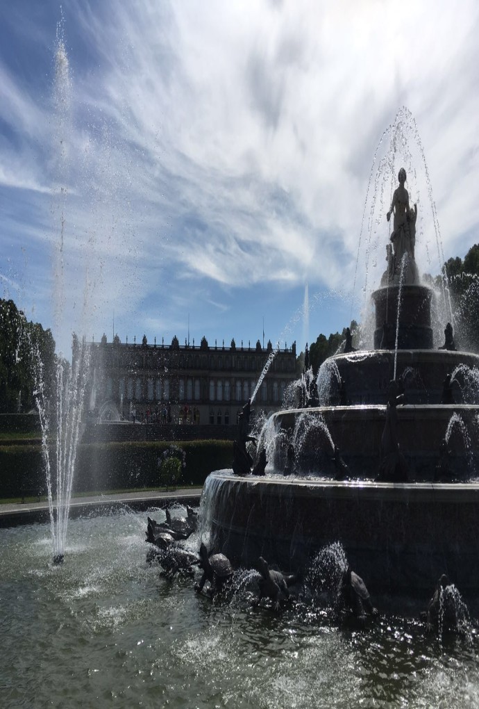 Fountain at Herrenchiemsee Castle, with a beautiful blue sky in the background
