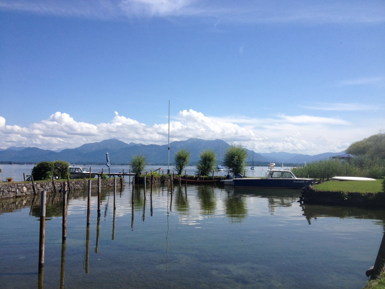 Beautiful scenery of Lake Chiemsee from Herreninsel, overlooking the lake and the Alps