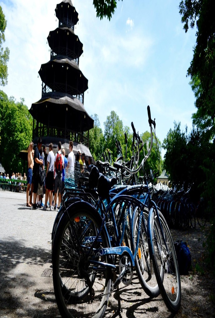 Blue bicycles, summer school students and the Chinese Tower can be seen in the background on a sunny blue summer day
