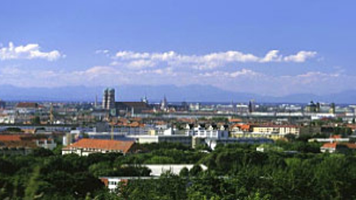 In the background the city of Munich and the Alps on a sunny and blue day,
