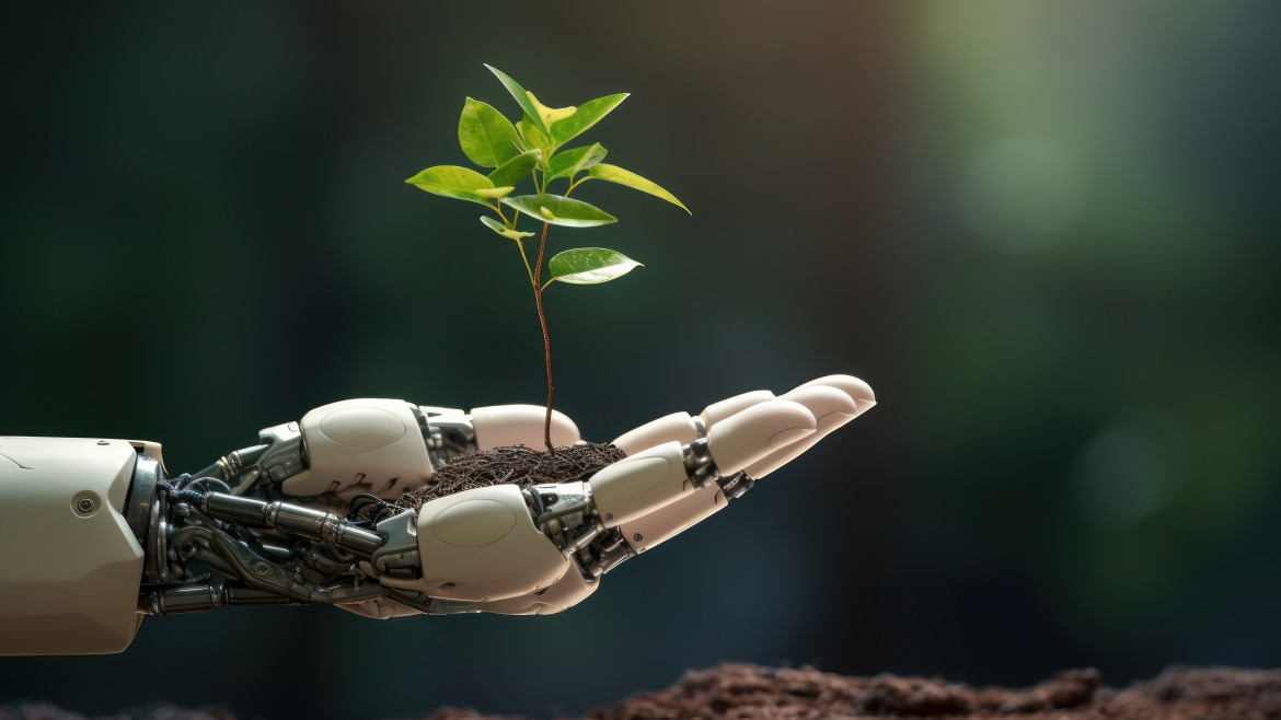 Nachhaltigkeit in Familienunternehmen (Stockfoto) Roboterhand hält kleine Pflanze
